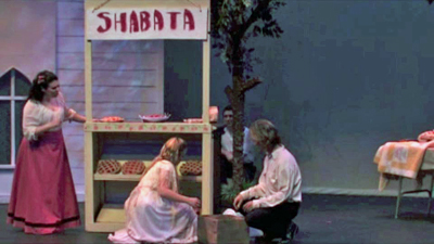 Marie, Angelique and Anthony set up the Cherry booth while Emil is hiding nearby